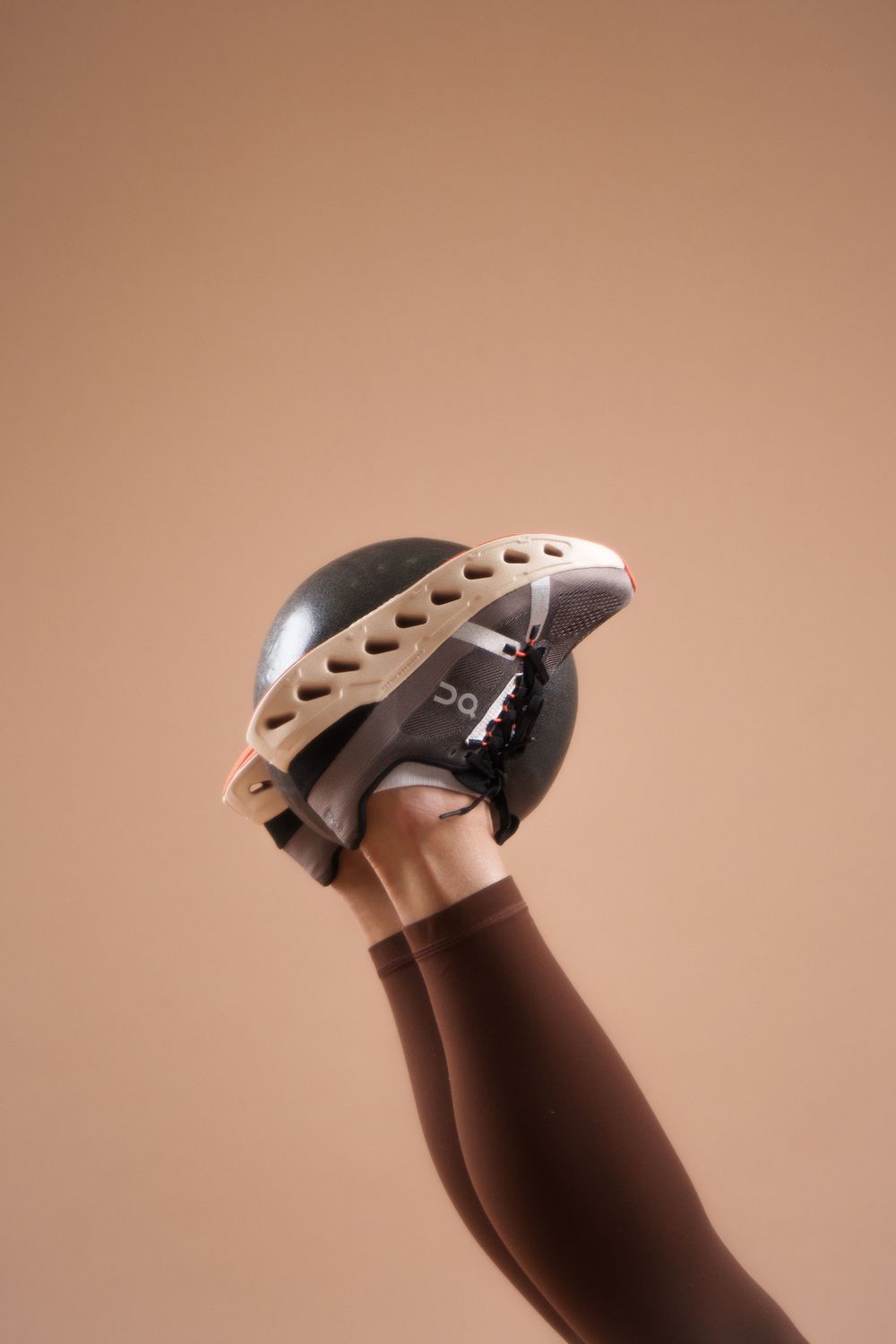 A cream-colored wine opener against a beige background shows the corkscrew in crisp detail.