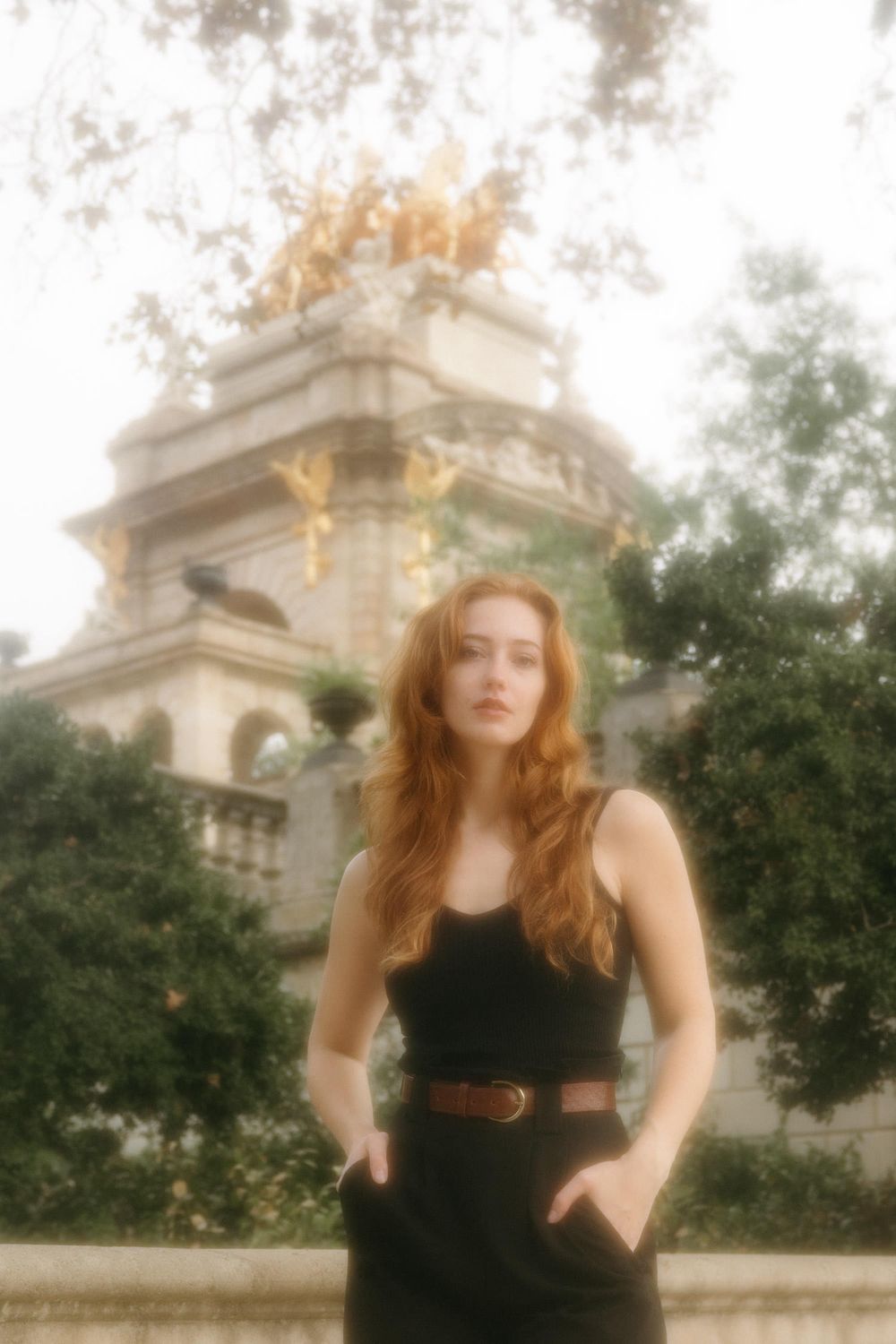 Dreamy portrait session at historic monument with soft vintage effect.