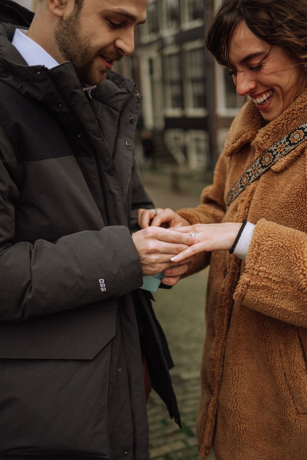 Close-up sequence showing hands exchanging a ring during a romantic proposal moment.