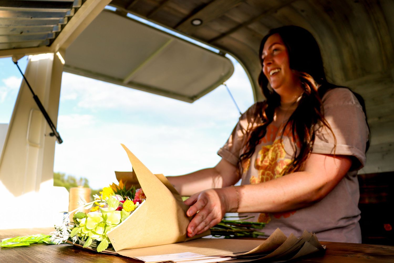 Branding of Free Spirit Flora an Utah native flower farmer as she wraps up a bouquet at her private make and take bouquet party.