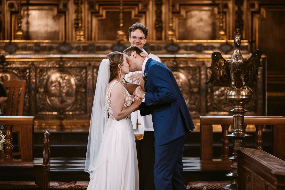 Newlyweds share first kiss during intimate church wedding ceremony at Balliol College, Oxford