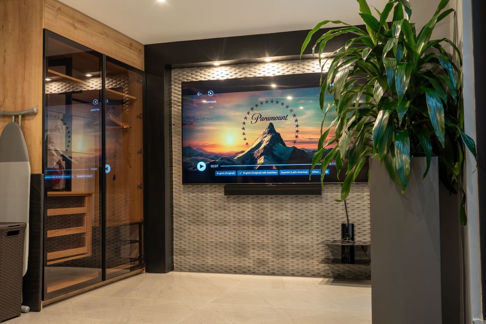 Cozy Airbnb living room with Netflix setup, perfect for a Thursday TV binge, professionally captured by Andrew Shainker.