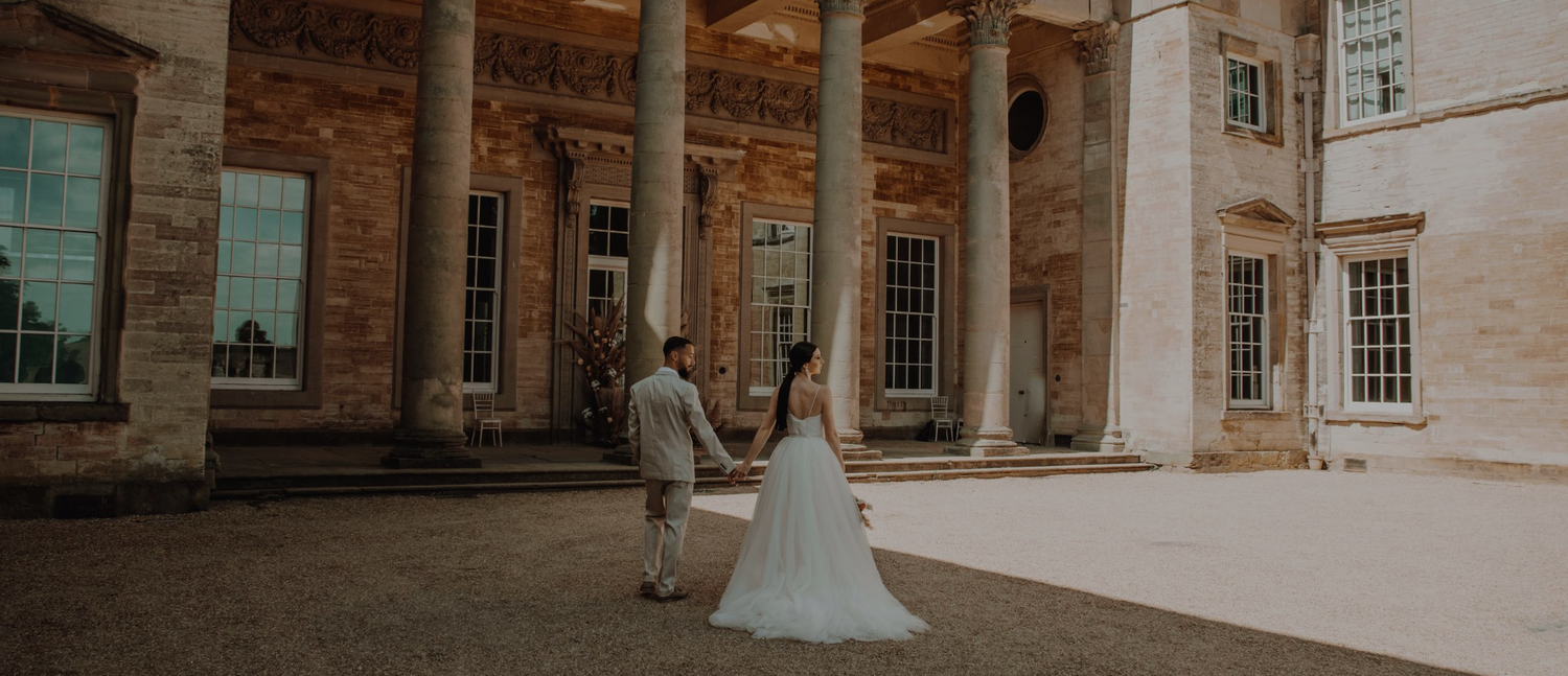 Couple walking together during a romantic photoshoot, capturing a natural moment