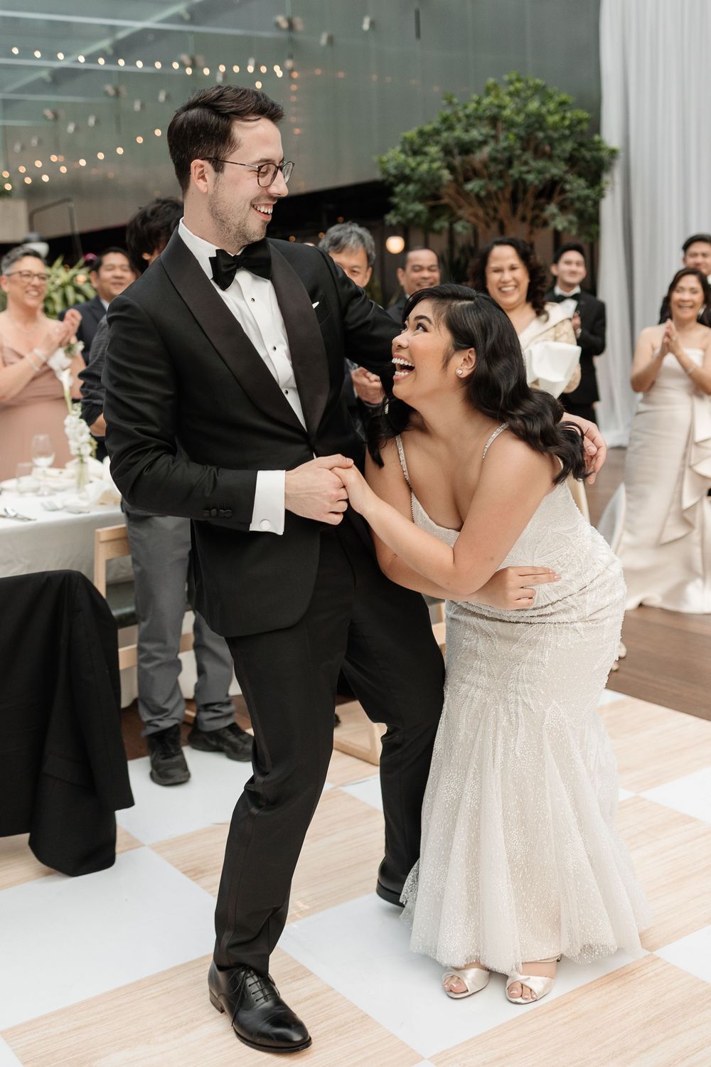 Bride and groom share a joyful first dance at their wedding, captured by Aliza Dworkind at Le Cathcart, a modern Montreal wedding venue