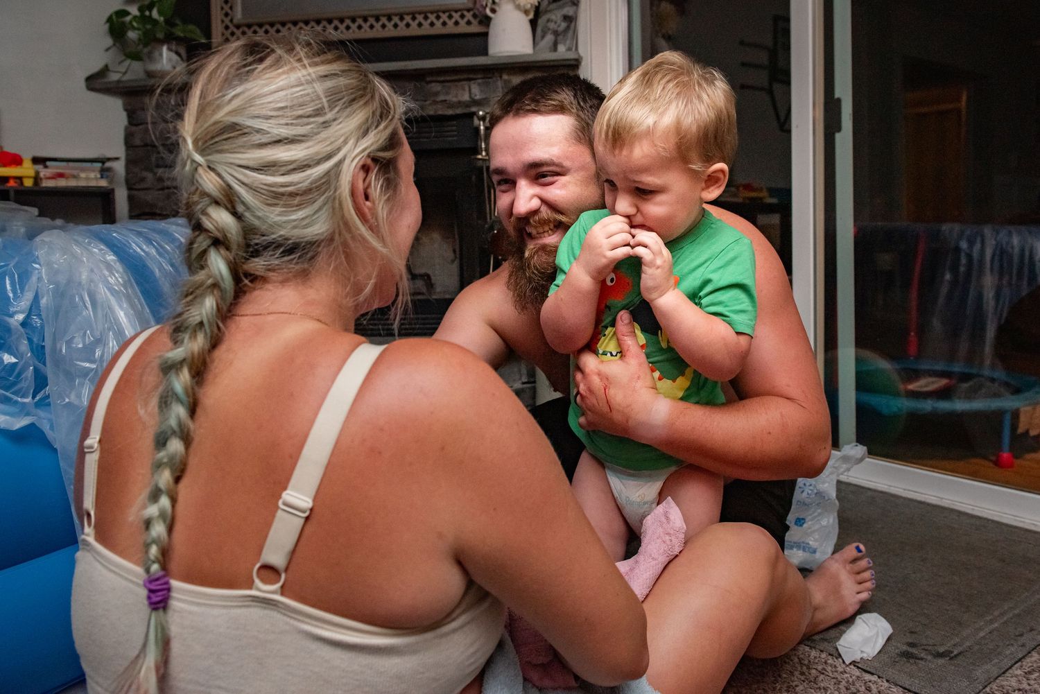 A series of connected photos showing a person feeding ice cream to a child on a sunny outdoor patio.