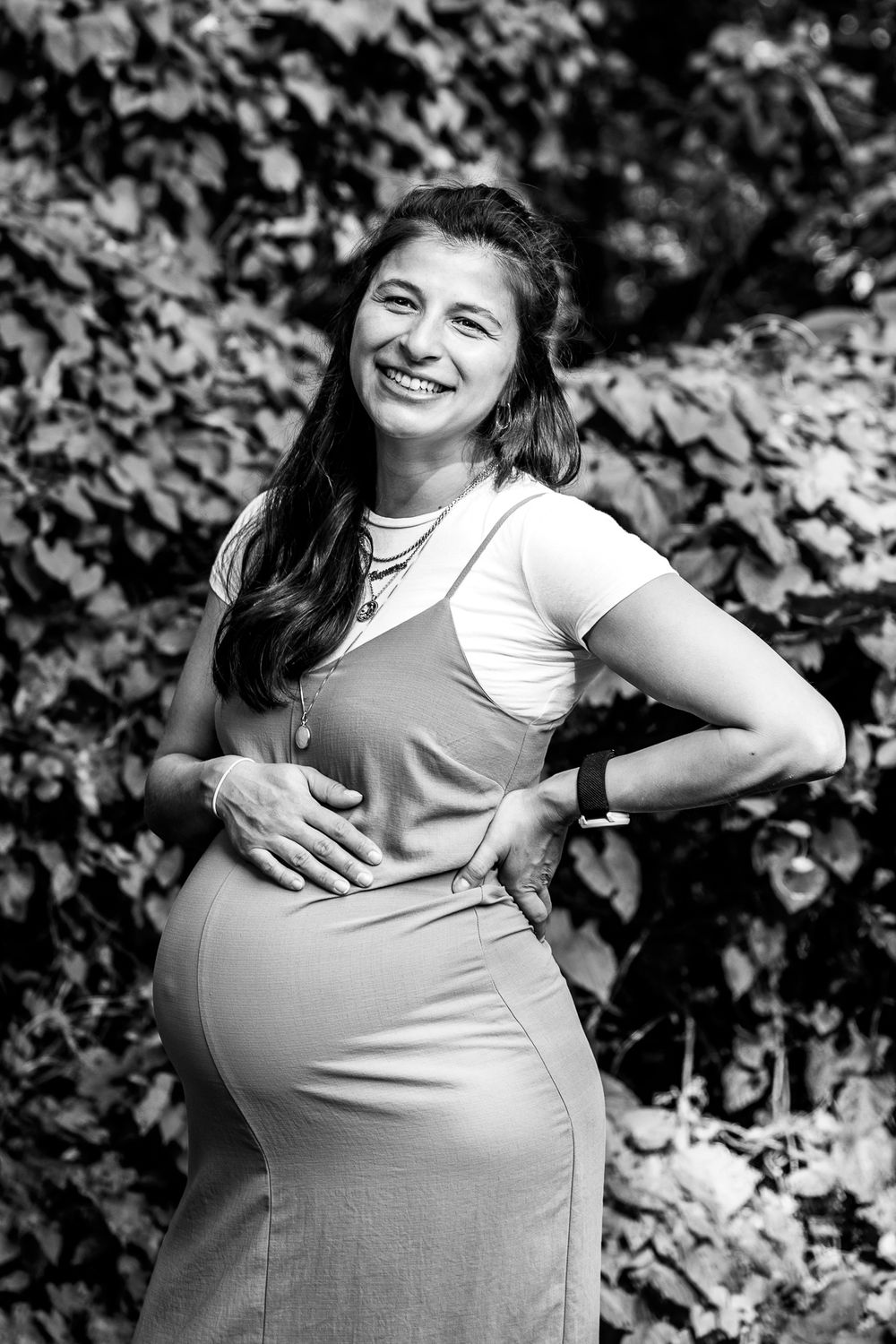 pregnant woman cradling her belly