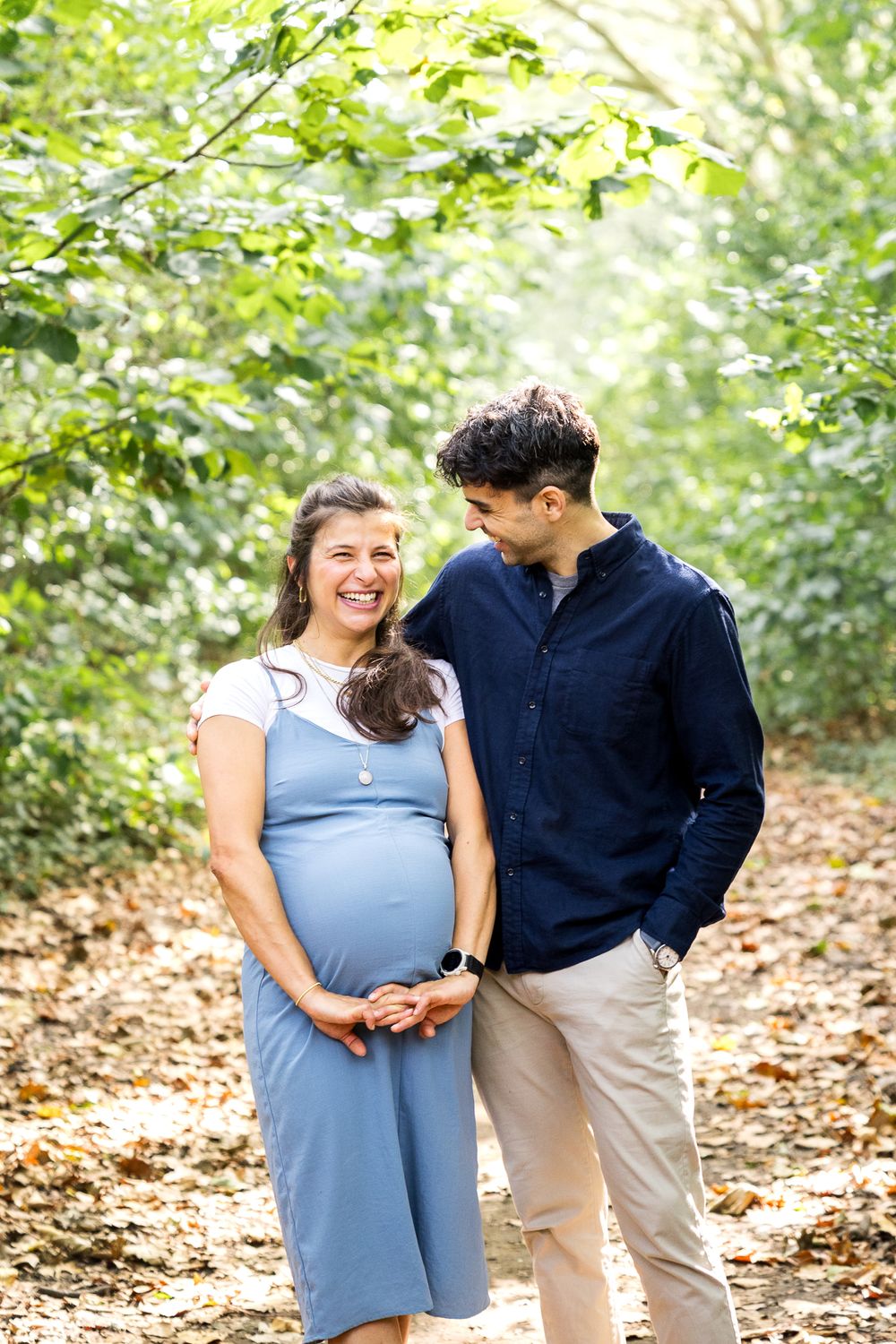 pregnant girlfriend with her boyfriend in the park