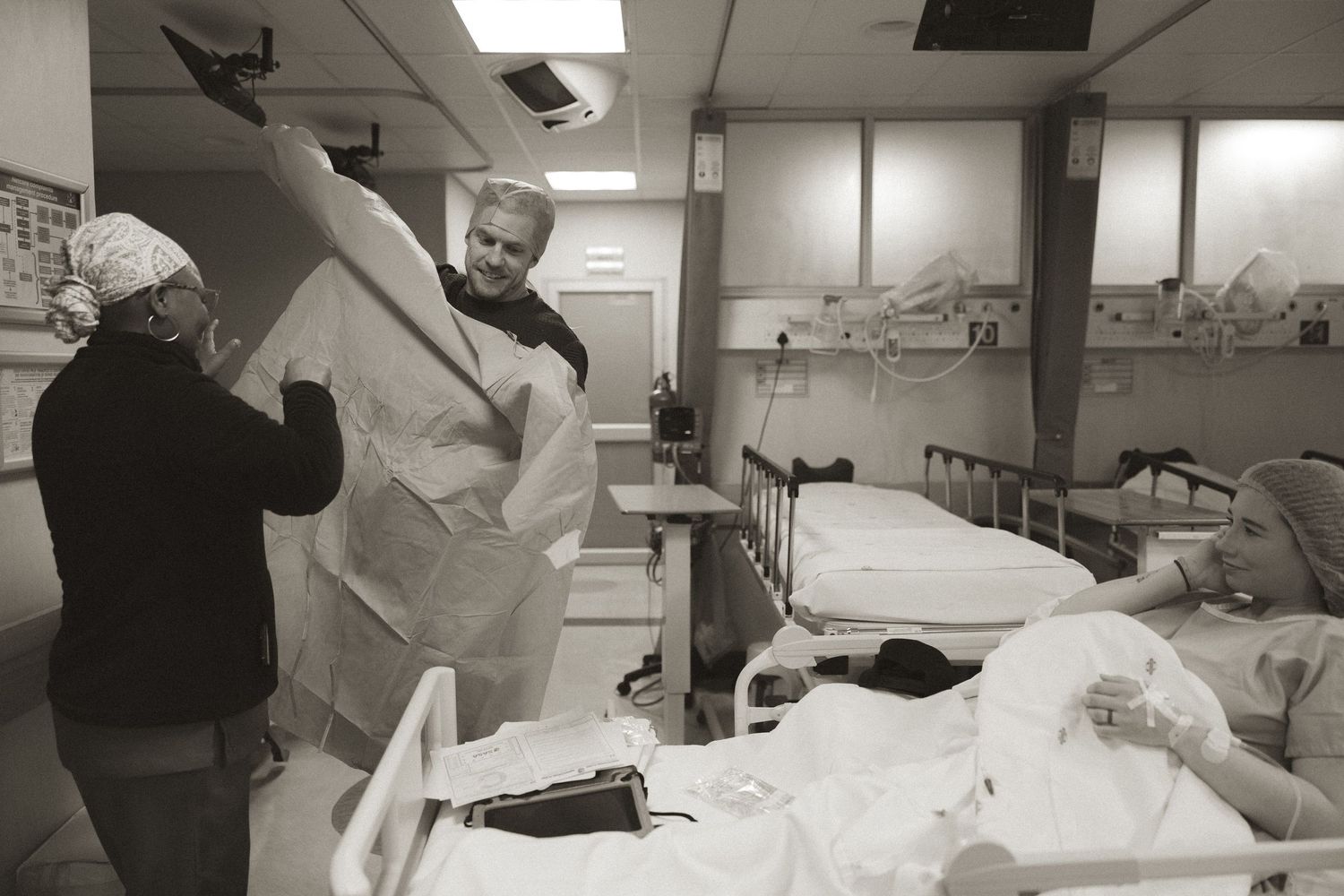 Black and white photo sequence showing medical professionals working in a hospital setting with patients and equipment.