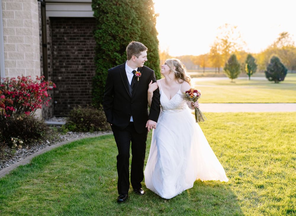 Wedding party photos taken at sunset with golden light on venue grounds.