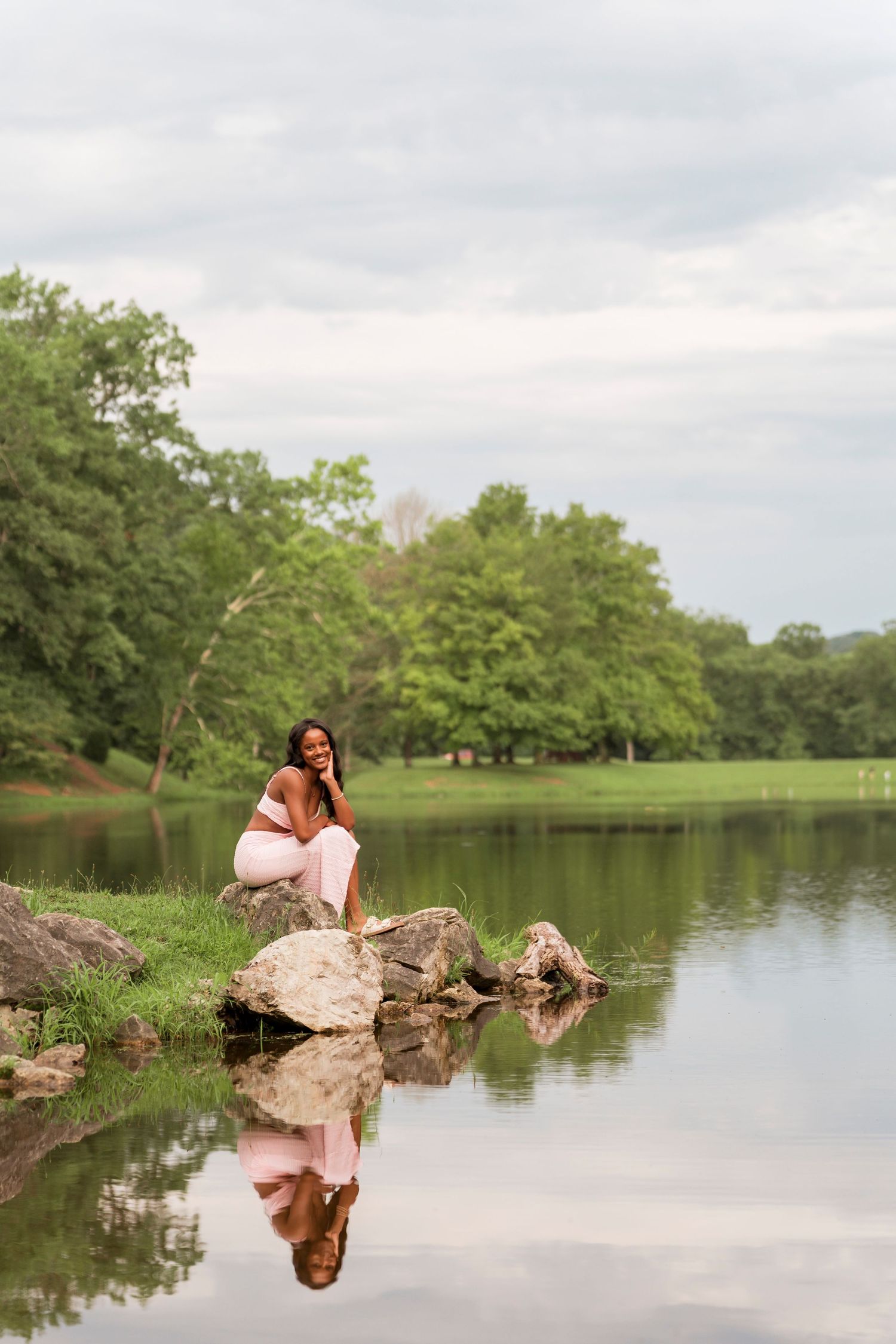 A joyful moment captured in a sunny wildflower garden with yellow blooms and natural lighting.