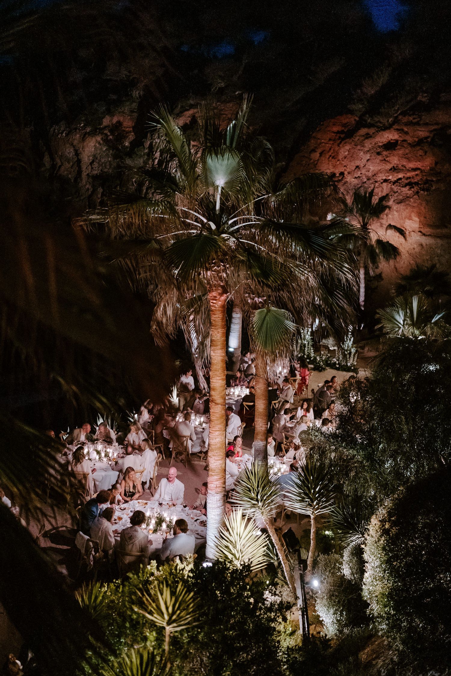 aerial view of wedding breakfast at night and palm trees at Amante Ibiza