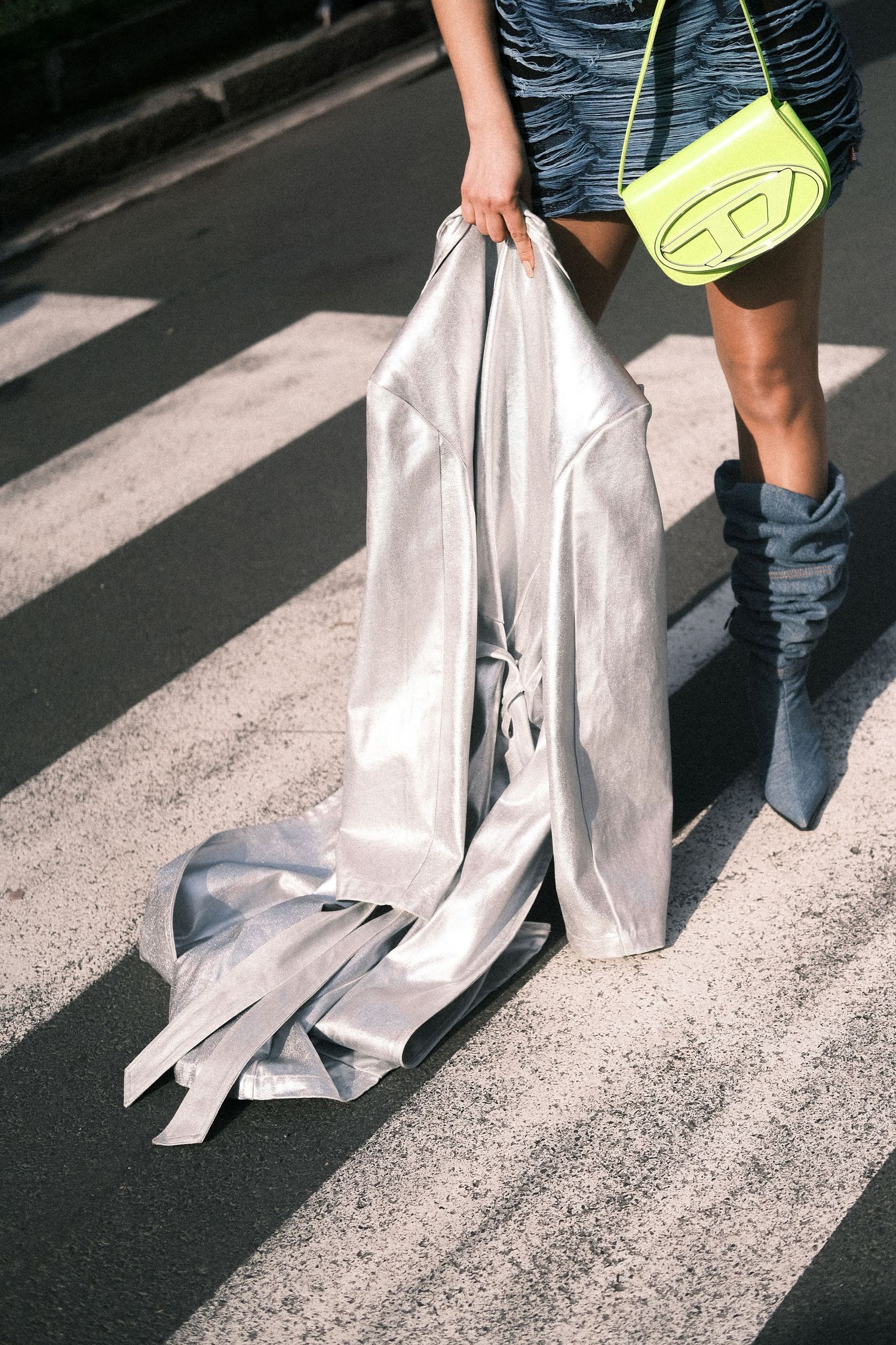 A sequence of images showing someone dragging a white plastic bag along a concrete surface in bright sunlight.