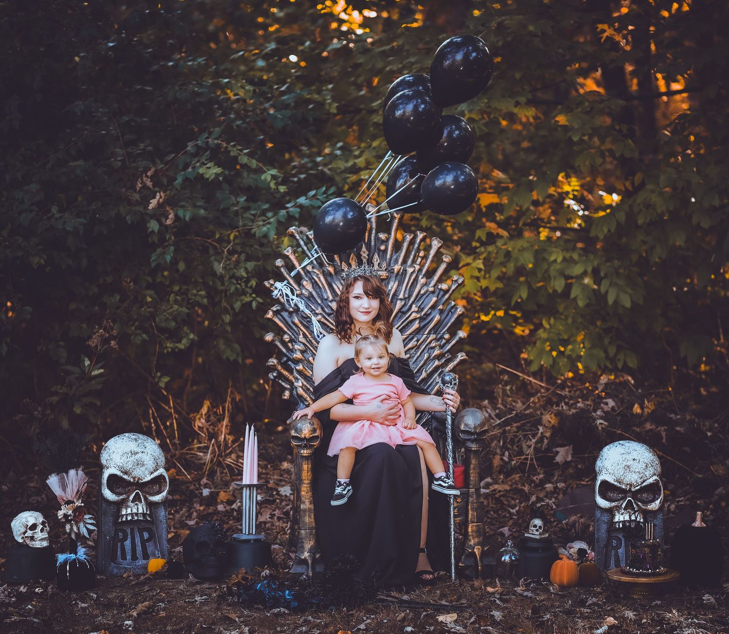 Halloween themed outdoor photo setup with spooky decorations and throne.