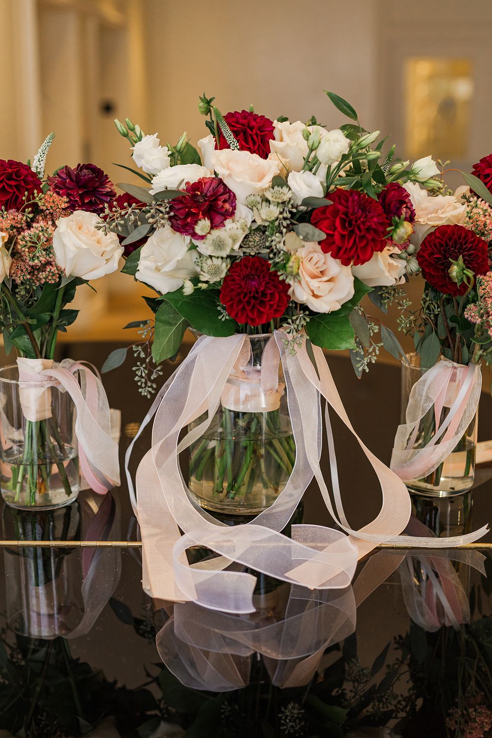 Bouquets sit on a reflective piano surface at The Walper Hotel in Kitchener, Ontario.