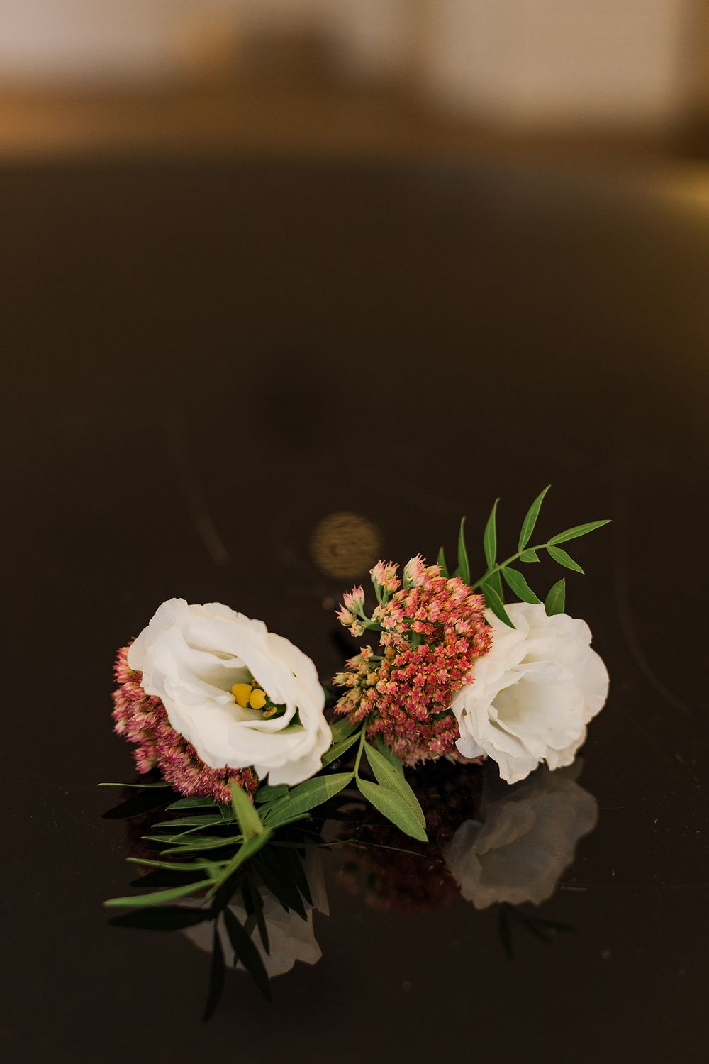 Boutonnieres sit on a piano surface at The Walper Hotel in Kitchener, Ontario.