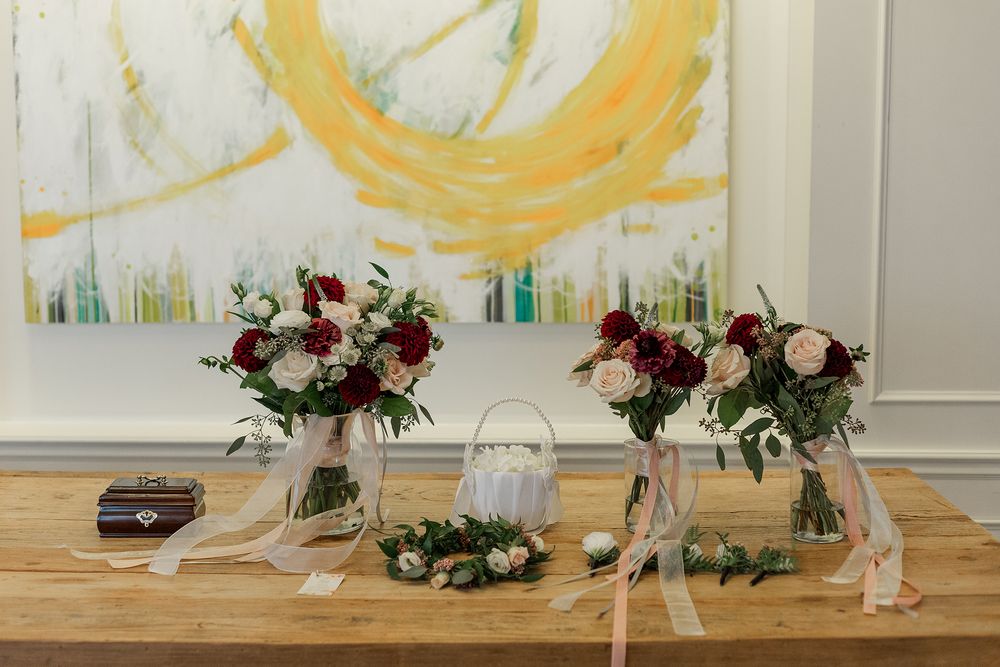 Wedding bouquets sitting on a table in the ballroom at The Walper Hotel in Kitchener, Ontario.
