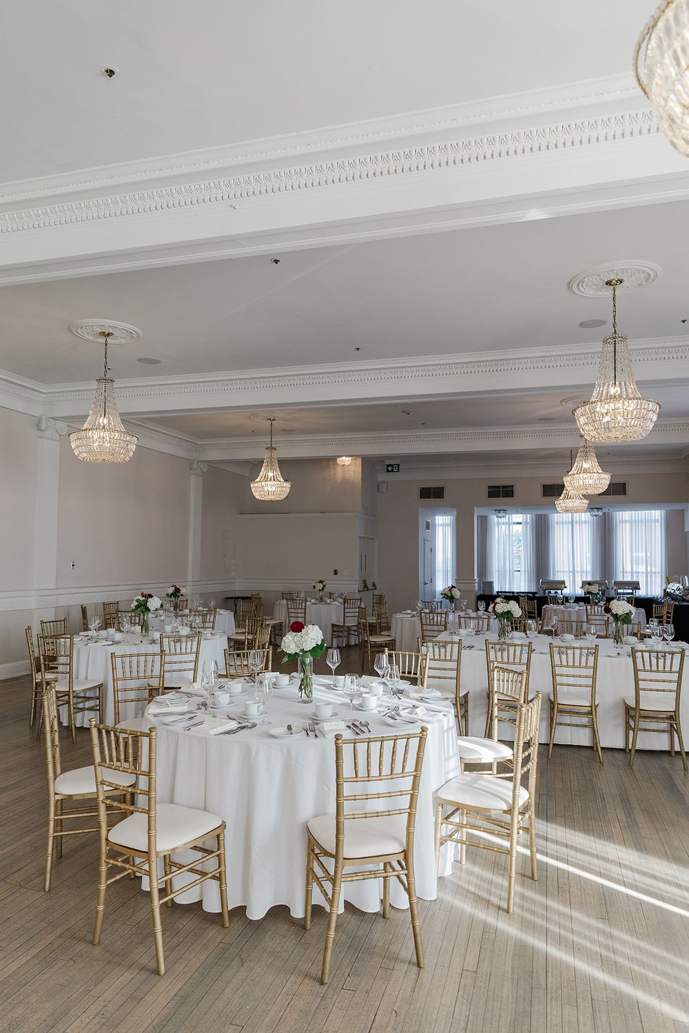 Tables and chairs set for a wedding in the ballroom at The Walper Hotel in Kitchener, Ontario.