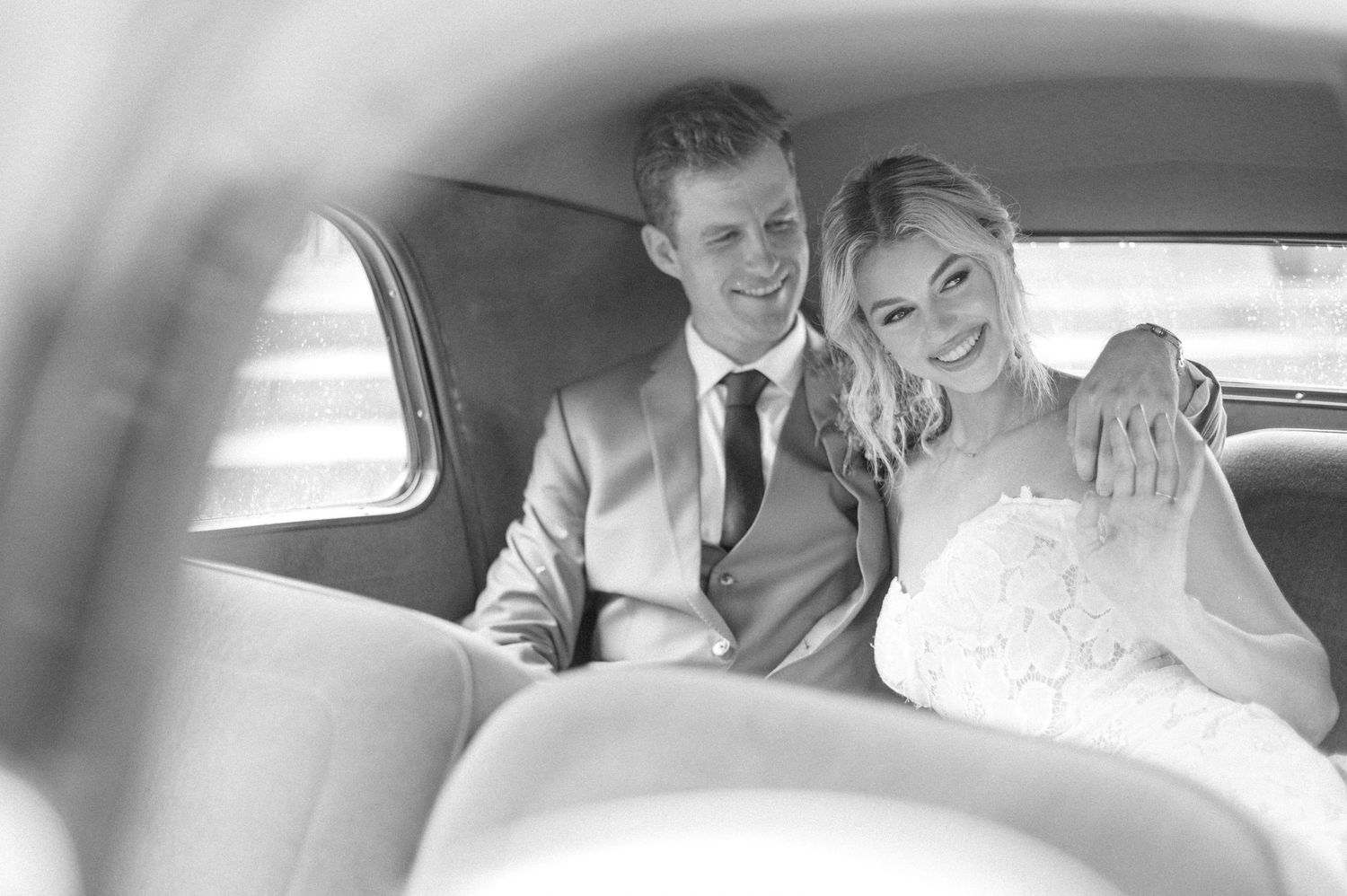 A collection of black and white wedding photos showing couples in cars and intimate moments during their special day.