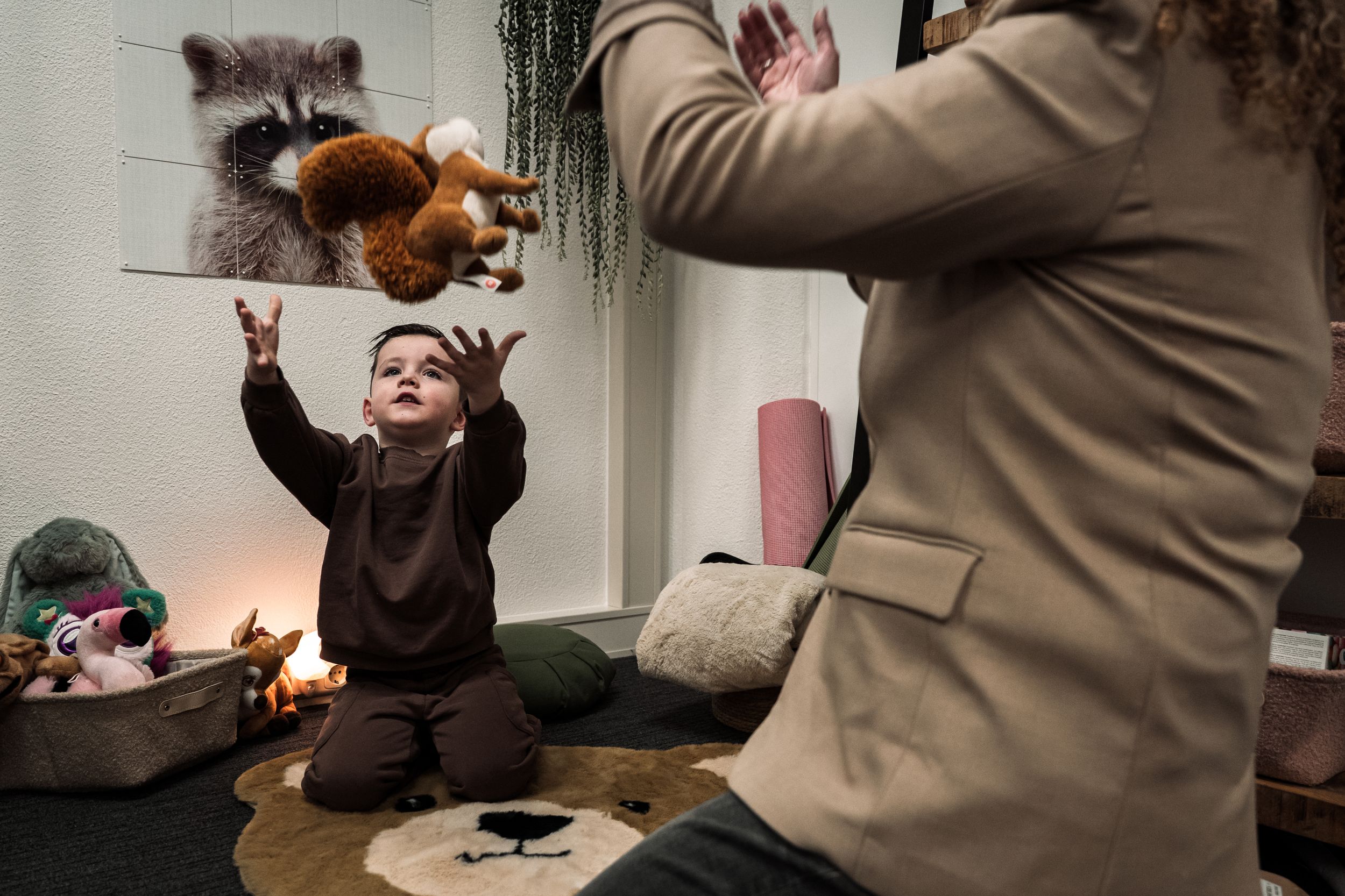 A series of photos showing someone lighting and blowing out candles on a cake in a dimly lit room.