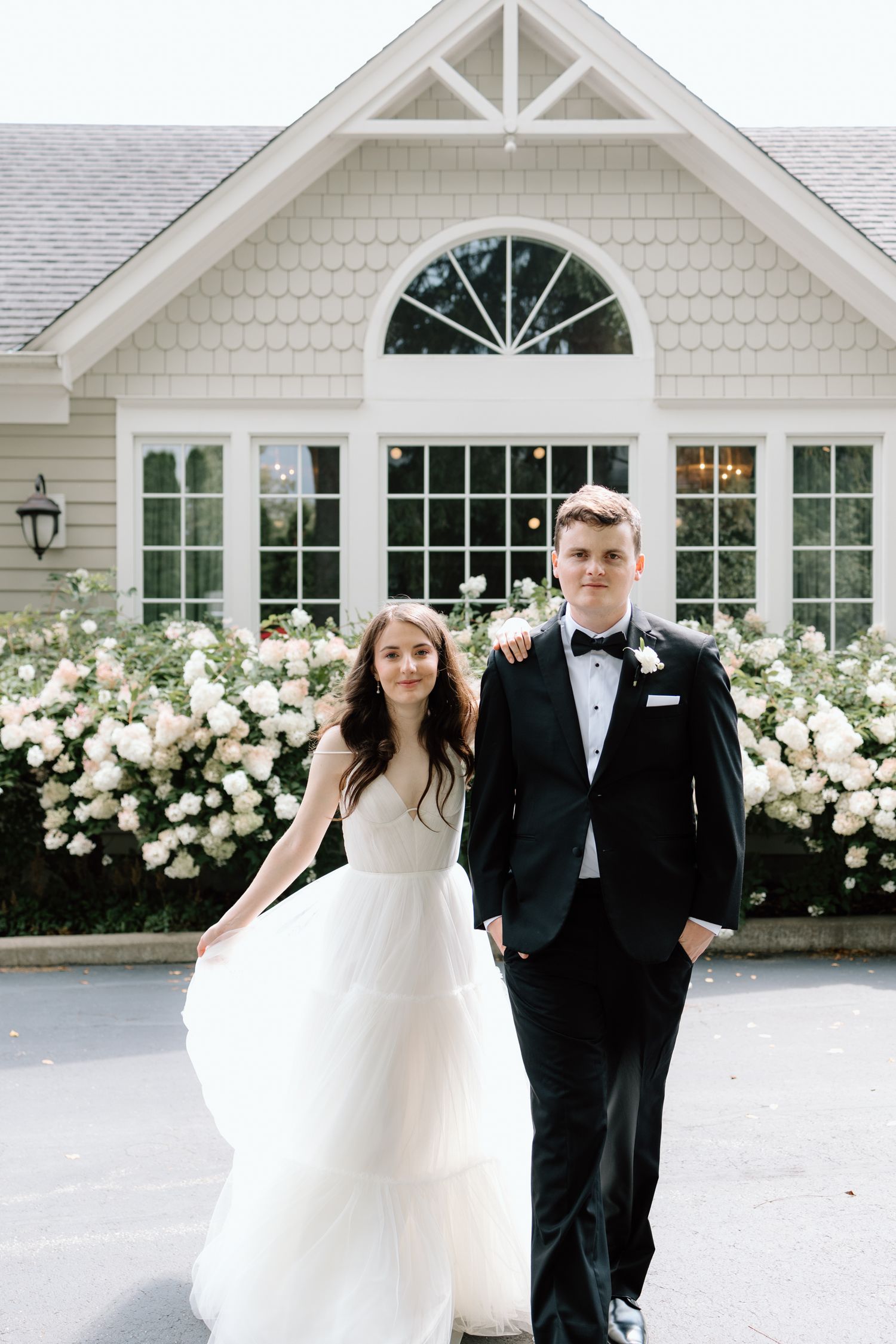 A romantic wedding photo sequence in a bright white studio shows the couple playfully interacting in four candid moments.