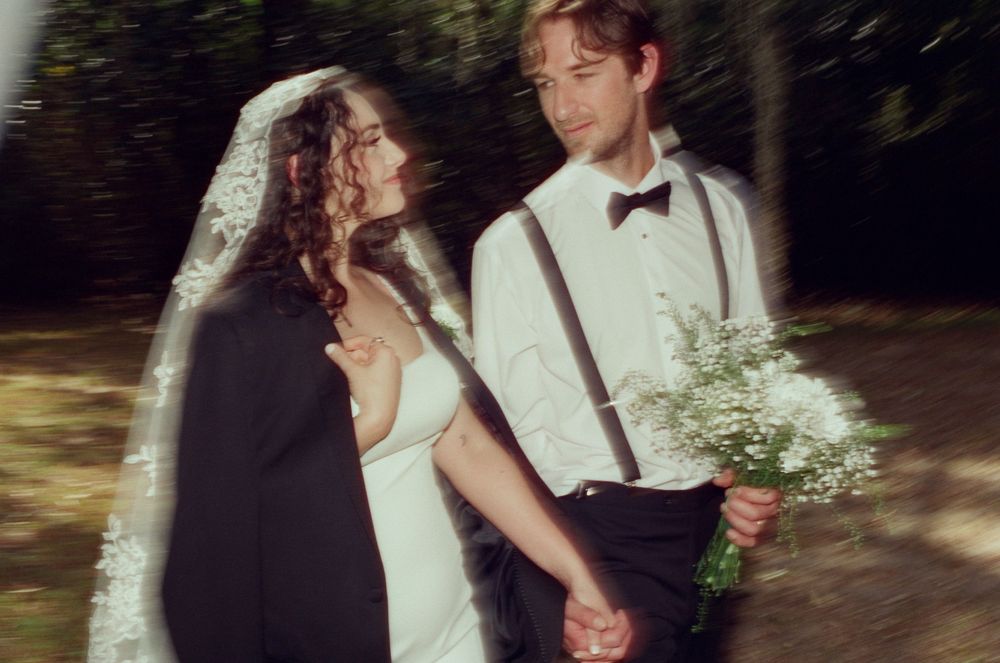 A romantic outdoor wedding photo series showing intimate moments between a couple in formal attire.