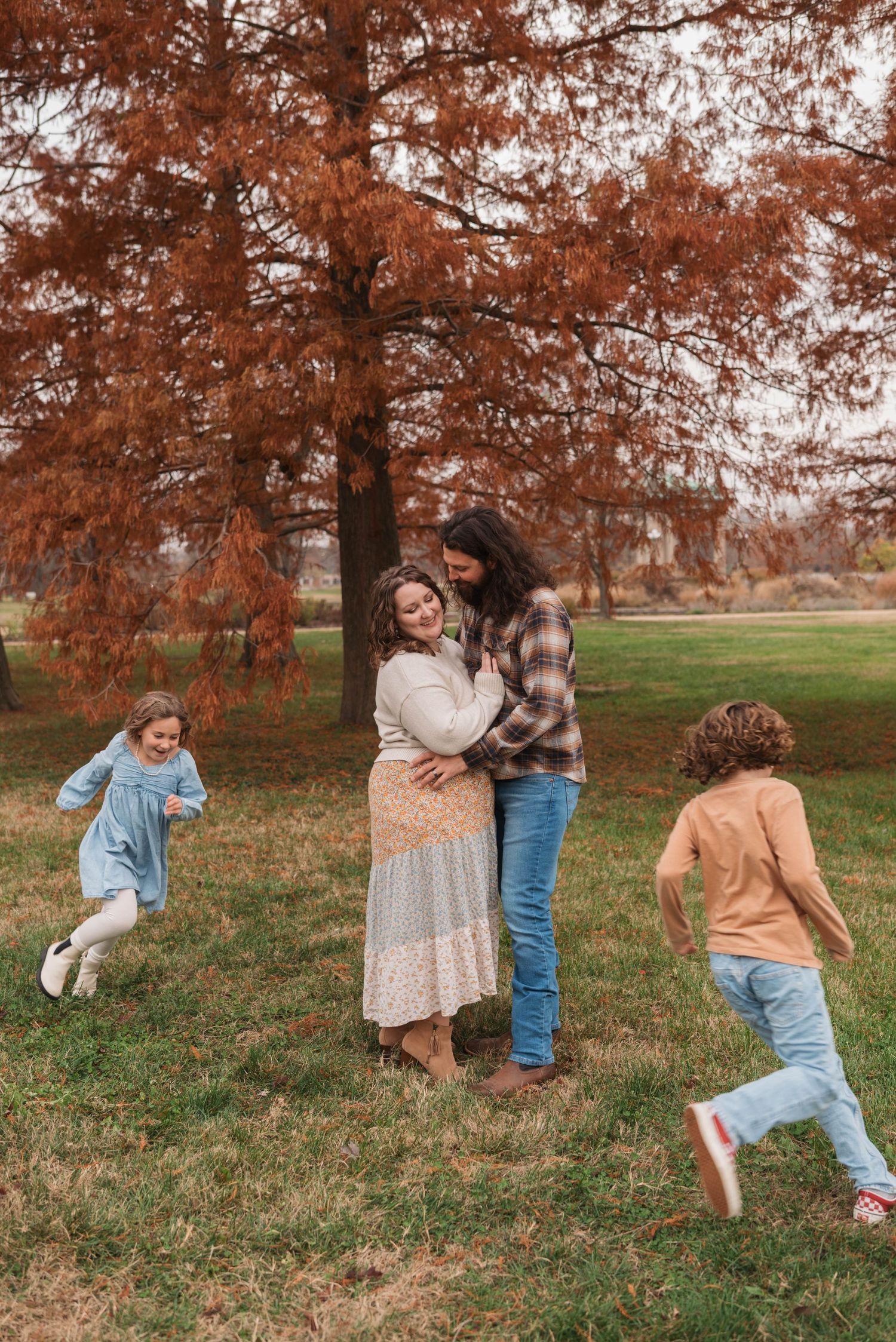 A sequence of autumn photos showing people playing and running through a park with orange-colored trees in the background.