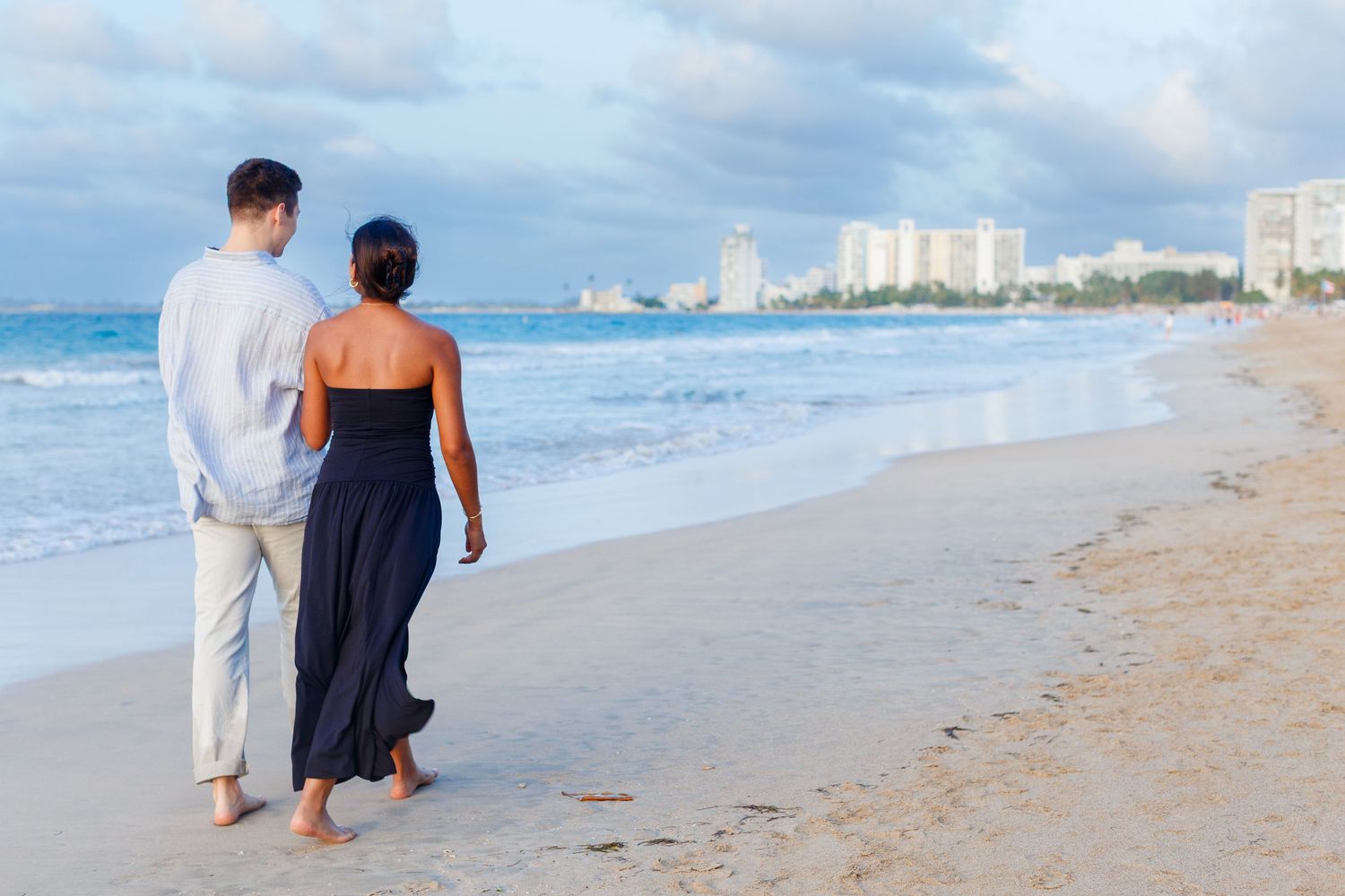 Couples portrait. Marriage proposal on the beach in Isla Verde, Carolina, Puerto Rico.