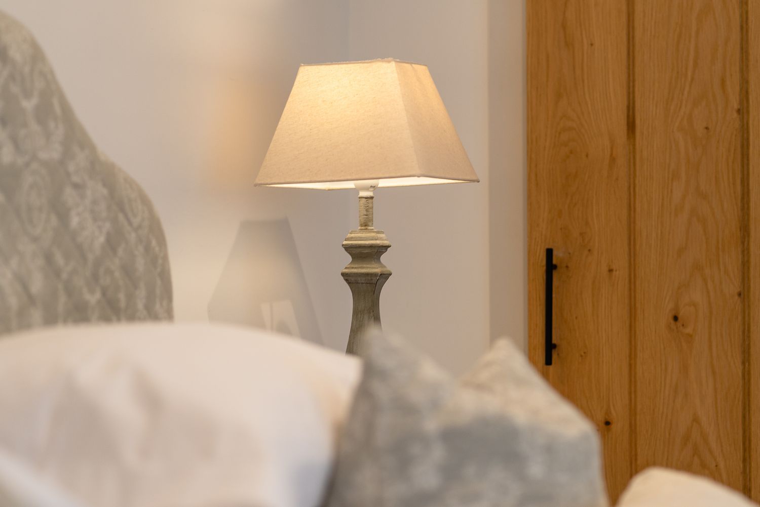 bedside lamp within luxurious bedroom