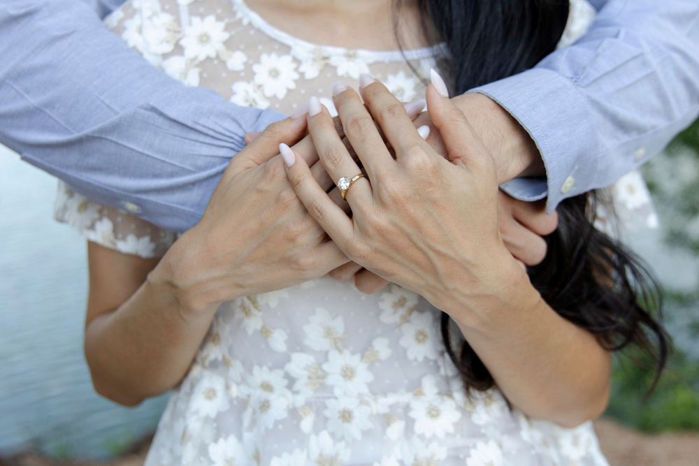 Dripping Springs engagement session with couple laughing and walking hand-in-hand