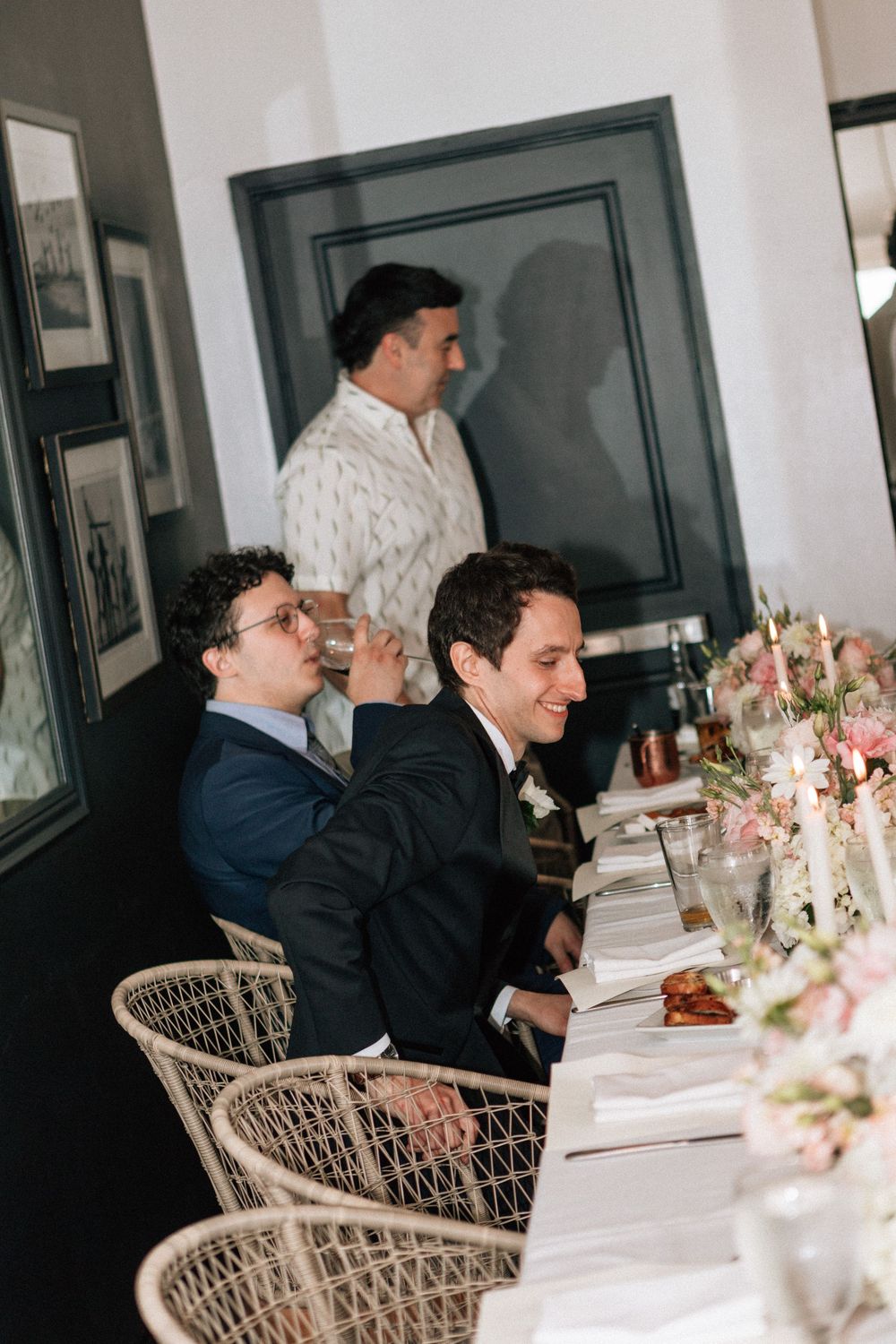 Malibu wedding photographer candid of guests during a wedding reception dinner.