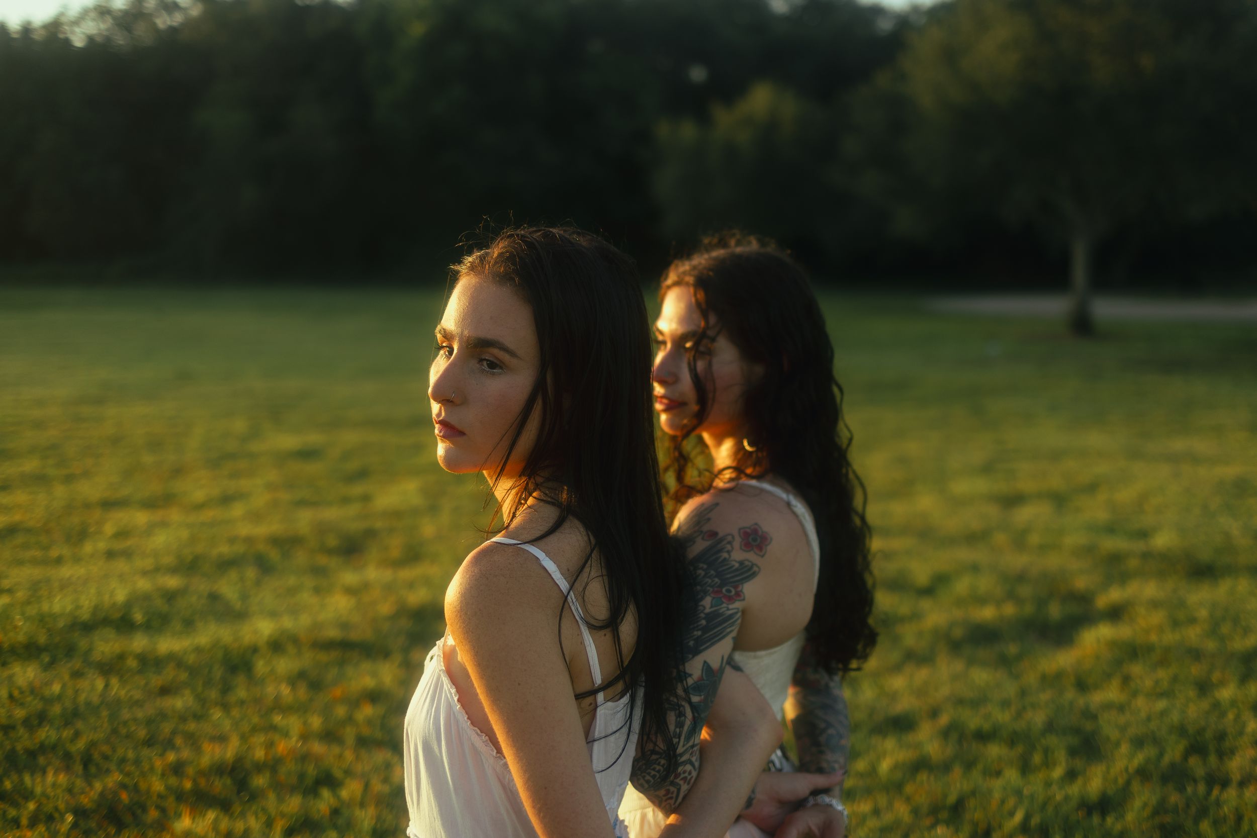Romantic Miami sunset portrait of two women embracing, cinematic editorial style for New World School actors by MannyPortraits