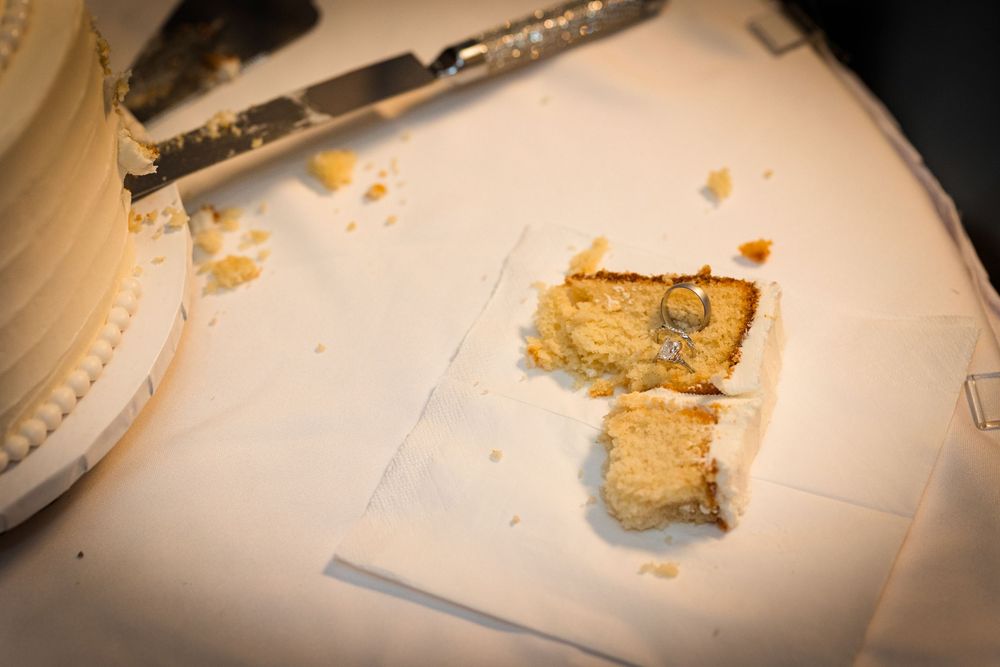 Close up view of crumbled bread or pastry pieces on a white surface.