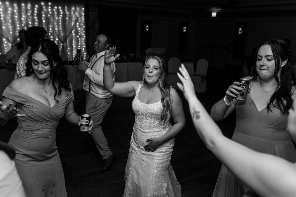 Black and white photo sequence showing people dancing and celebrating at a dimly lit party or reception.