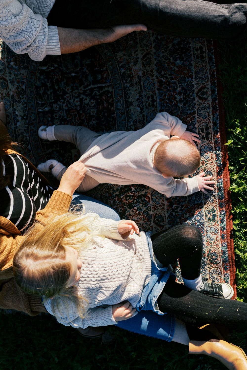 Series of black and white images showing a playful moment lying on the ground in a natural setting.