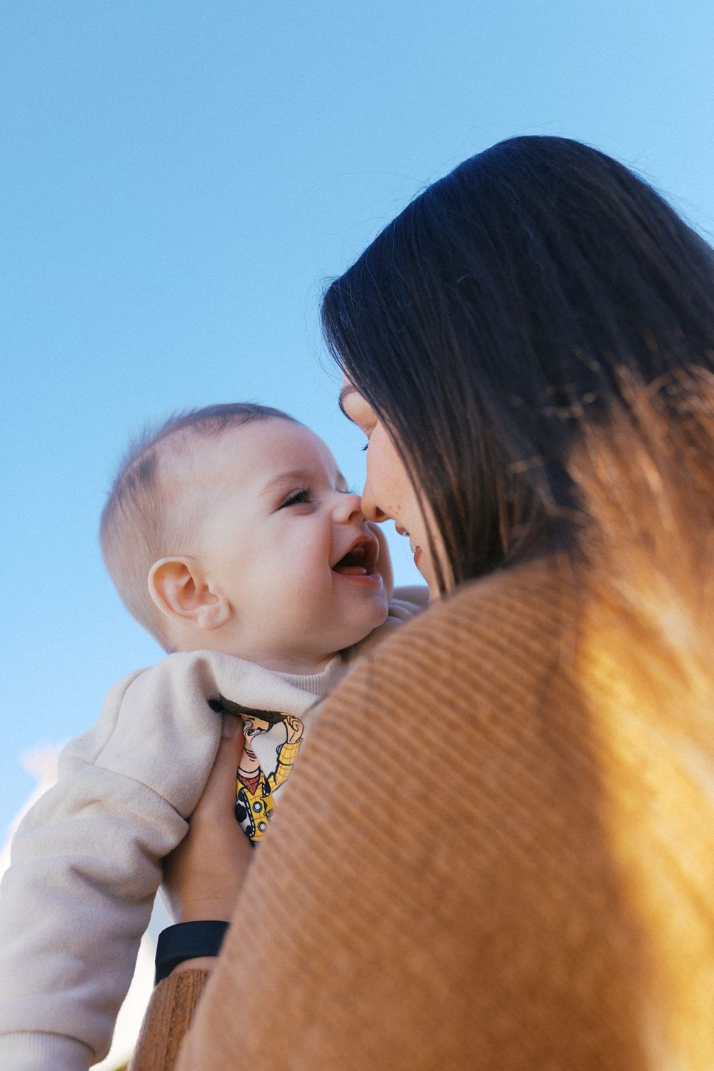 Heartwarming sequence of joyful interactions against a bright blue sky background.