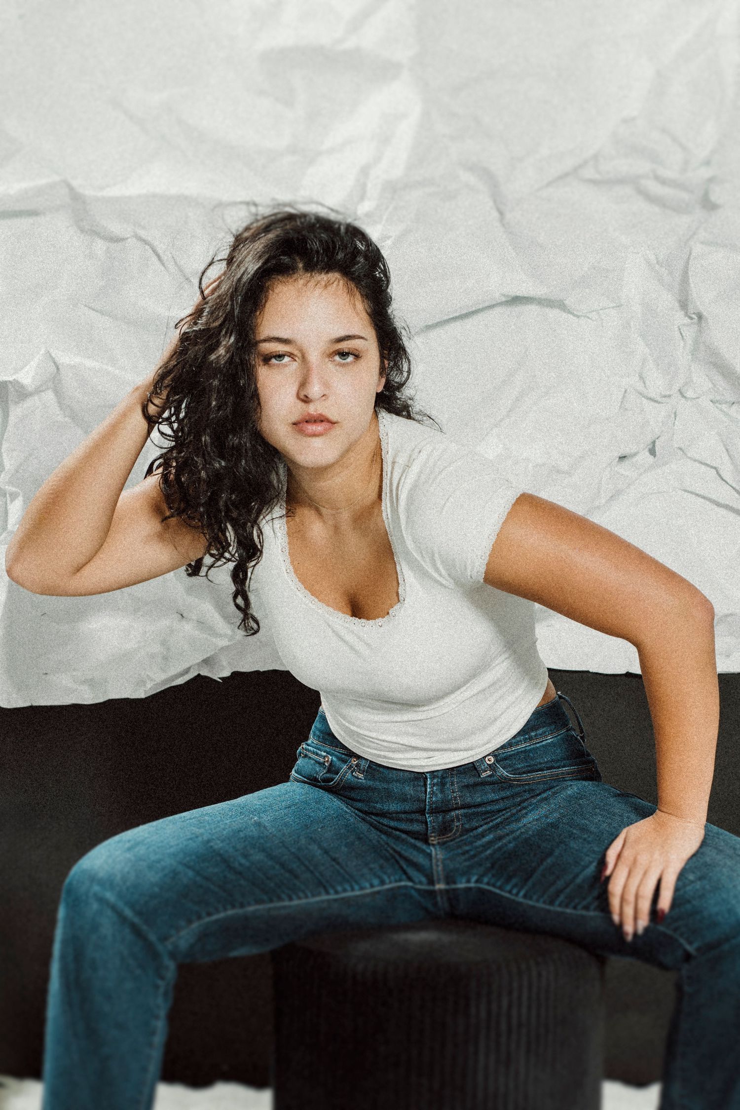 Multiple shots of someone in casual attire posing playfully against a white background.