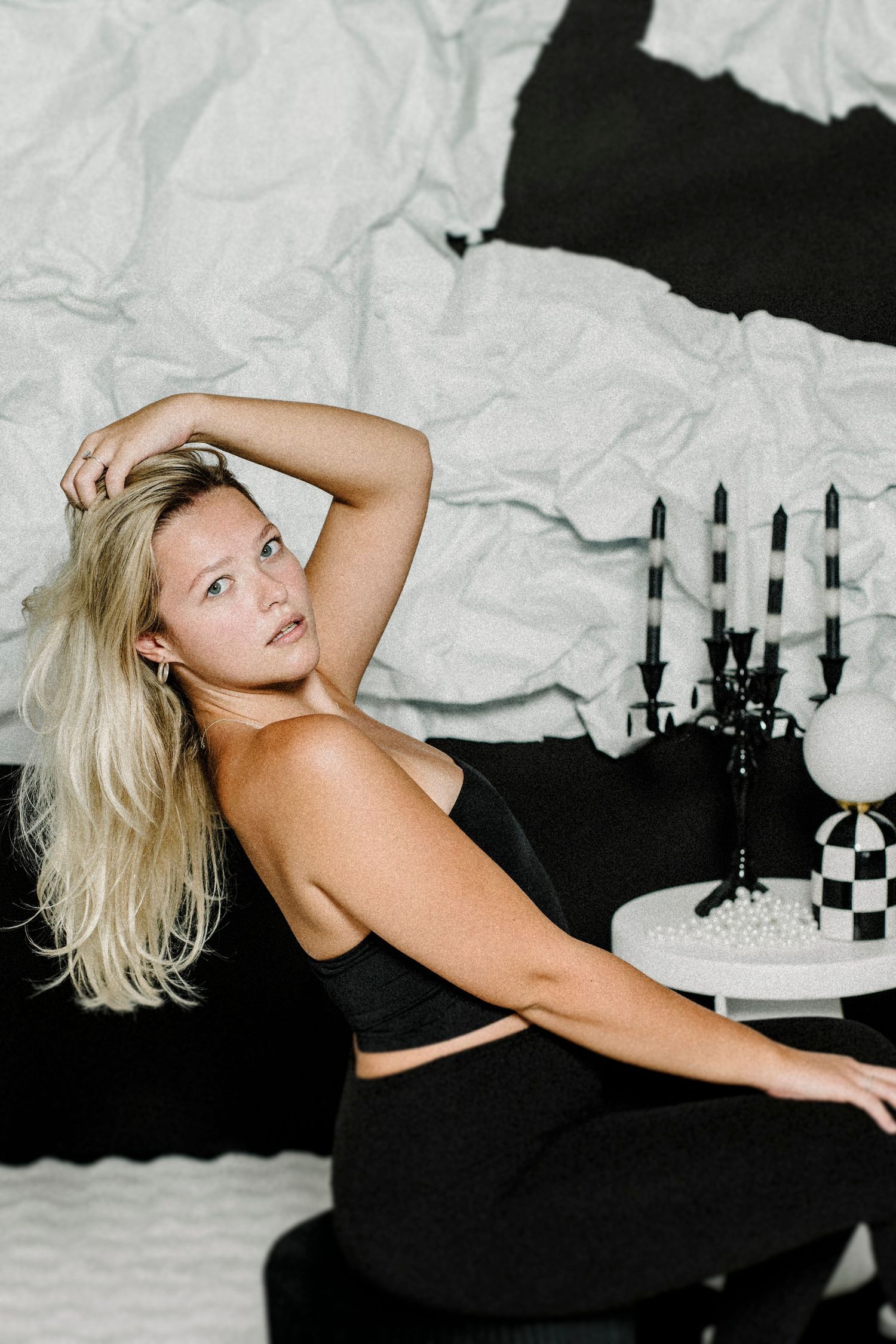 A series of expressive dance poses against a black and white backdrop with dramatic lighting effects.