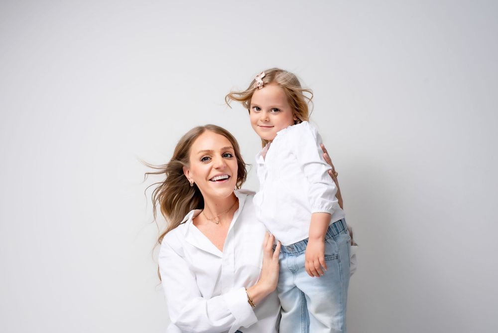 Mother and daughter portrait with family studio photography