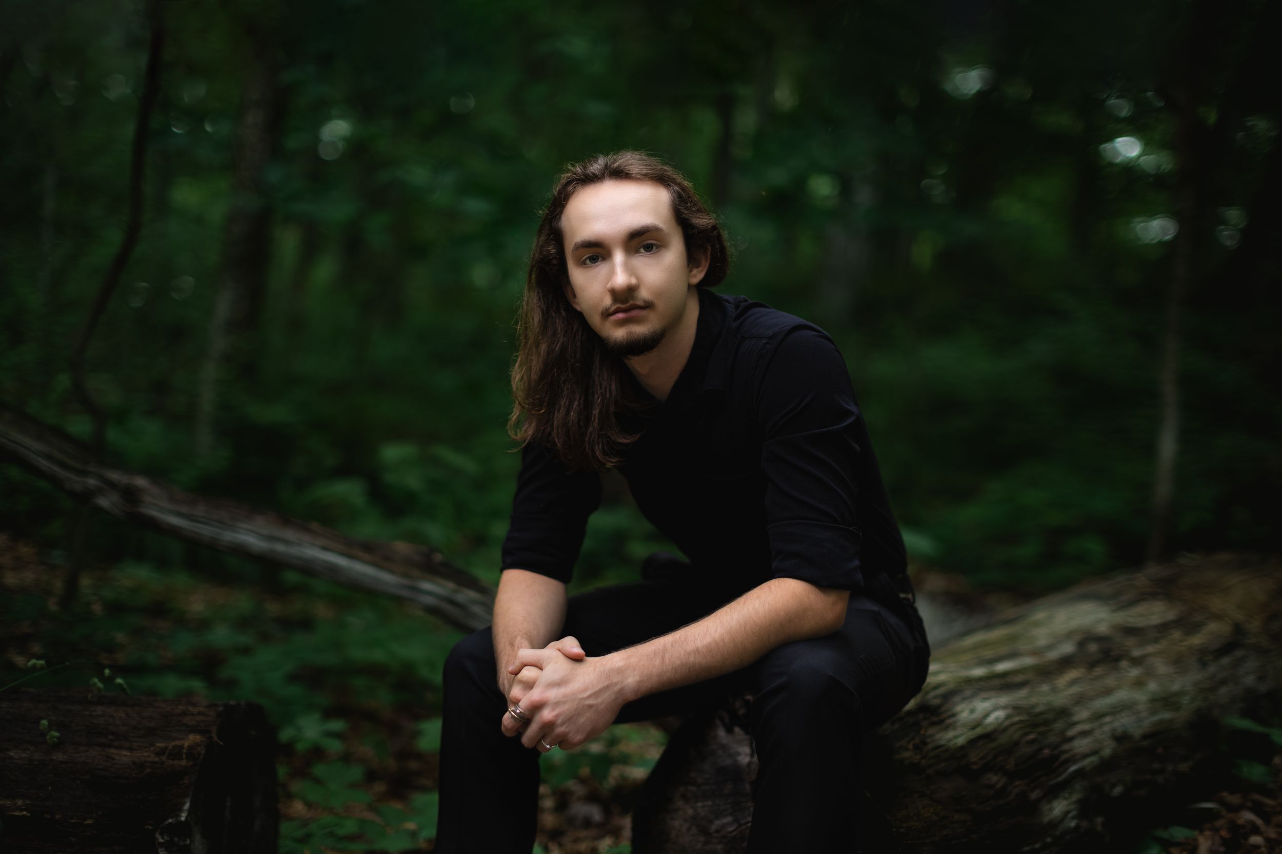 Alt aesthetic senior guy portrait session in forest Pinckney, MI woods by Brighton, Michigan photographer