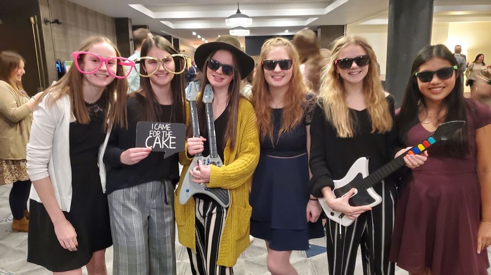 A group of people wearing sunglasses poses for a series of informal fun photos in a collage.