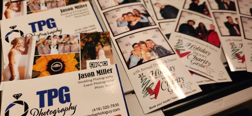 A close up view of business cards displayed in a row showing various headshots and contact information.