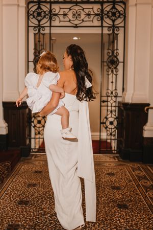 A series of candid moments at a wedding venue showing dancing and celebration on an ornate patterned carpet.