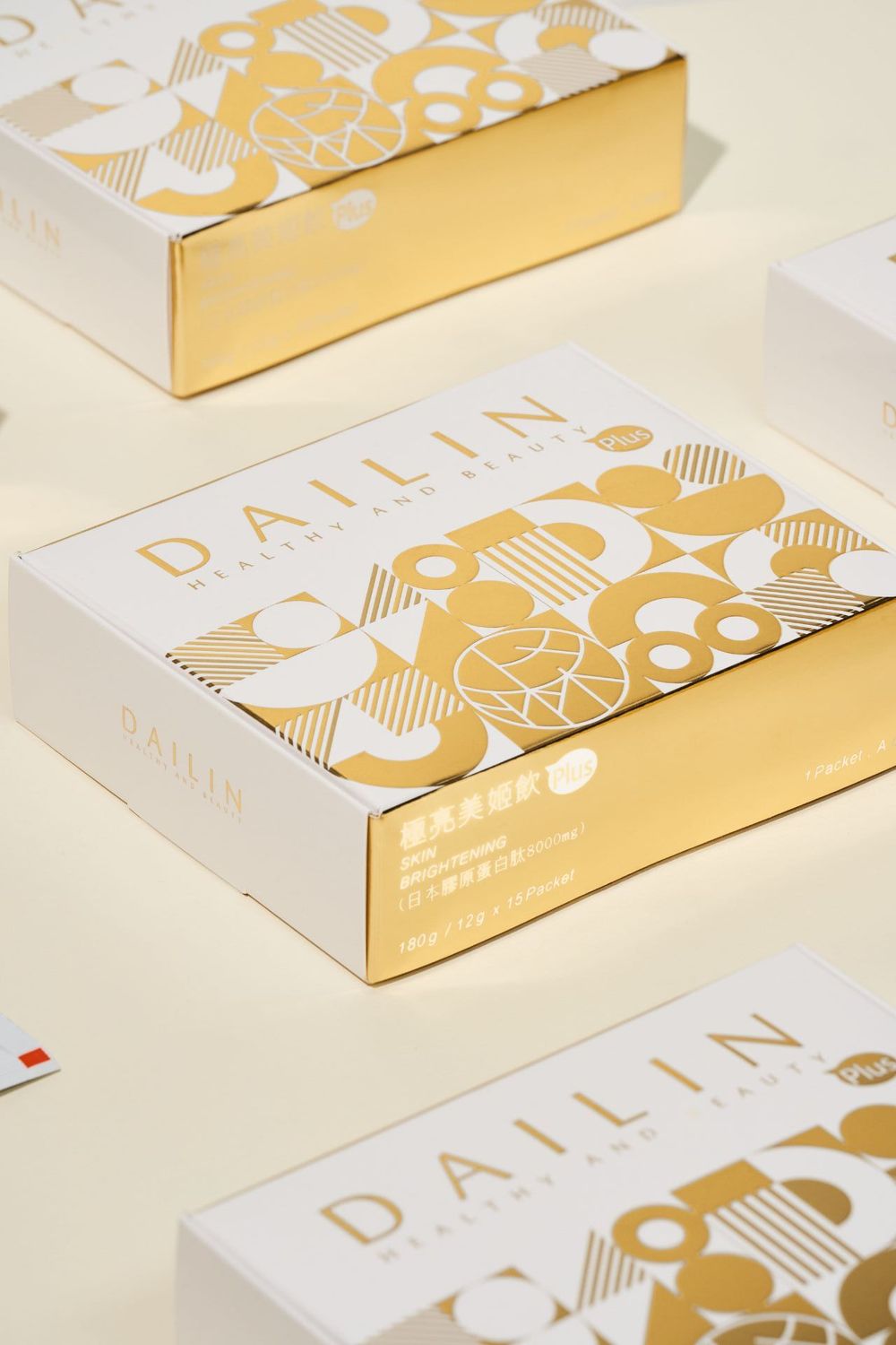 Elegant white and gold business cards featuring minimalist geometric patterns arranged at different angles on a light surface.