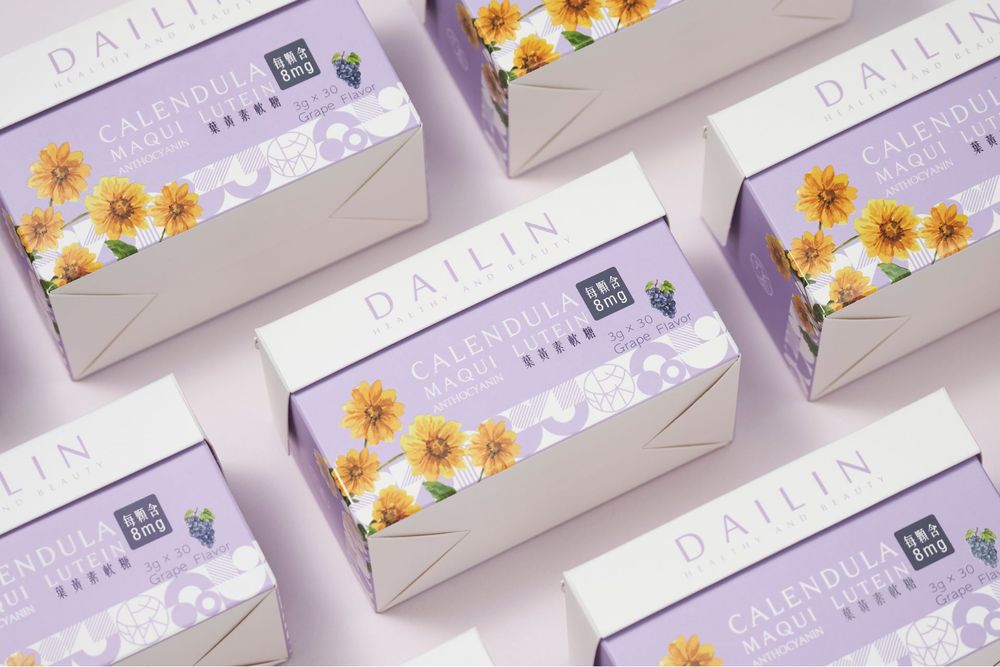 Multiple white product boxes with floral designs arranged in a diagonal pattern against a light purple background.