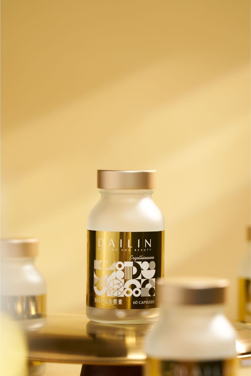 Artistic product photography sequence showing gold-labeled cosmetic cream jars against a warm beige background.