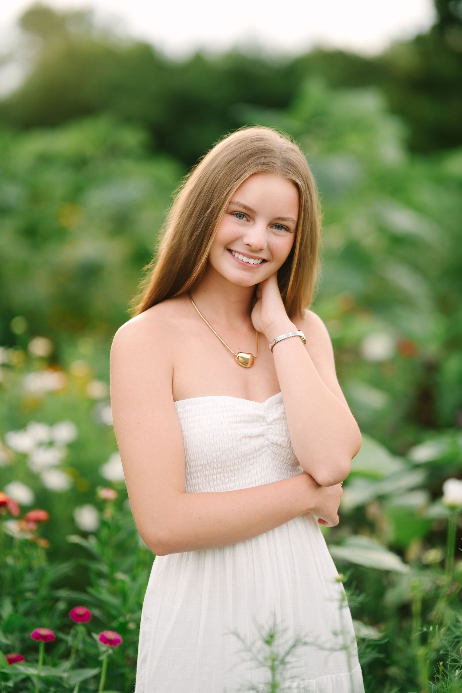 High school senior smiling during relaxed senior photography session in Toledo