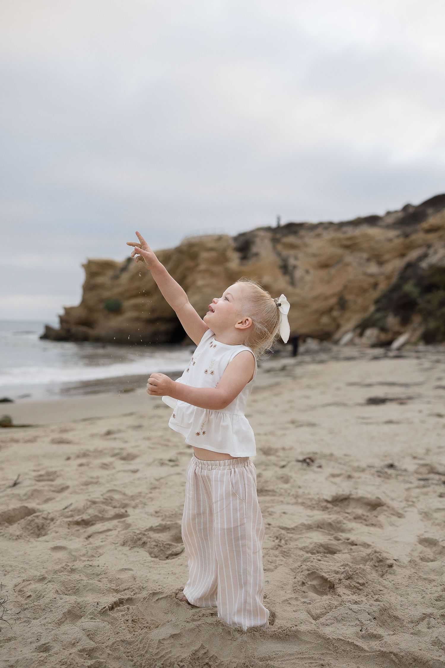 Orange County beach family photos at Crystal Cove with playful candid moments