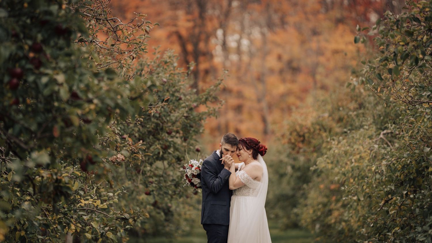 A duo of wedding photographers capturing the memories of a bohemian wedding in Saint-Joseph-du-Lac, Quebec — an autumn celebration