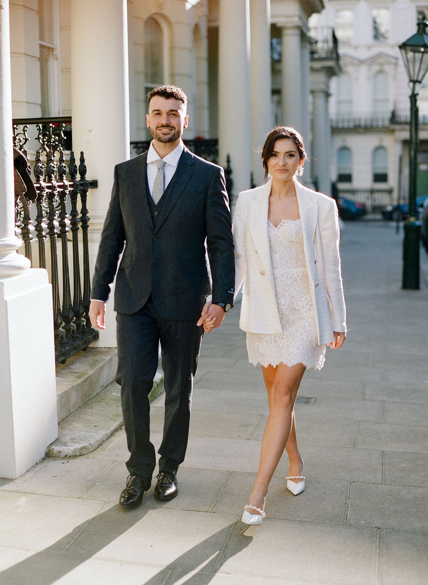 Romantic wedding photography session on a classic London street with columns.