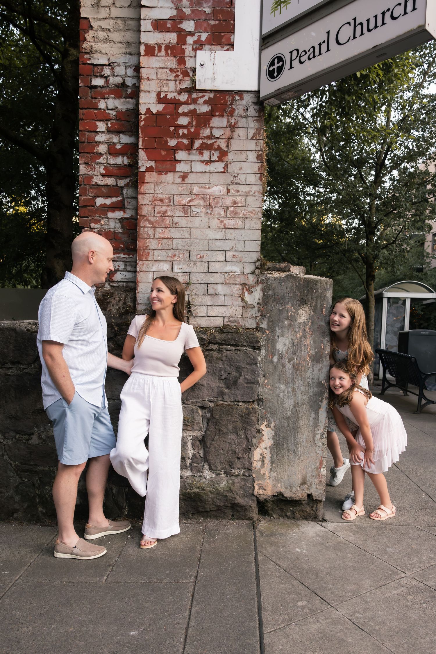 A sequence of candid moments captured outside a brick church building showing playful interaction.